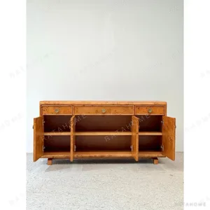 Poplar Burl Sideboard with Bronze Fittings in rust — in a room setting