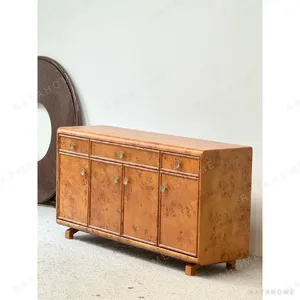 Poplar Burl Sideboard with Bronze Fittings in rust — in a room setting