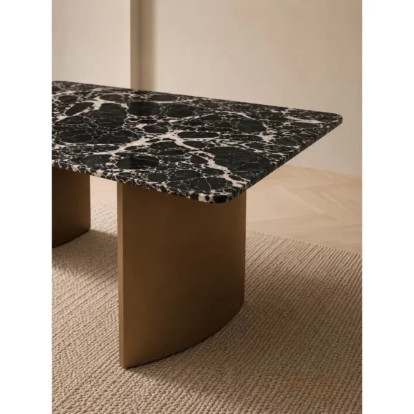 Black and White Marble Dining Table on Antique Bronze Legs in black — in a room setting
