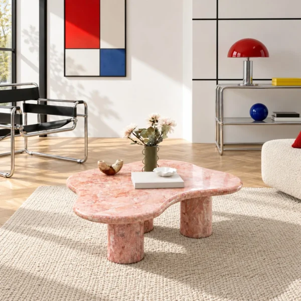 Pink Cloud Marble Coffee Table on Cylinder Legs in rose stone — in a room setting