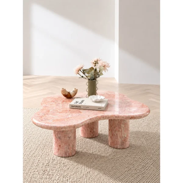 Pink Cloud Marble Coffee Table on Cylinder Legs in rose stone — in a room setting