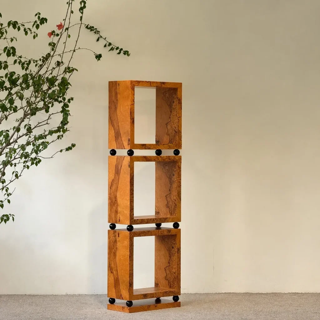 Burl Veneer Tall Bookshelf with Black Stud Detail in clay — front view