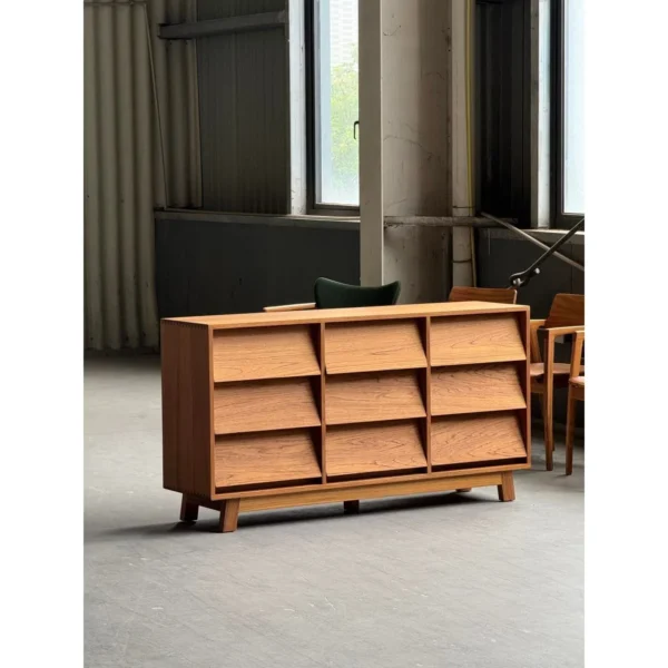 Burmese Teak Nine-Drawer Chest with Angled Fronts in clay — in a room setting