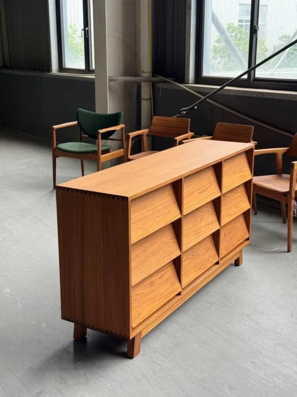 Burmese Teak Nine-Drawer Chest with Angled Fronts in clay — in a room setting