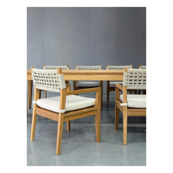 Burmese Teak Outdoor Long Table with Woven Armchairs, 300 cm in natural oak — in a room setting