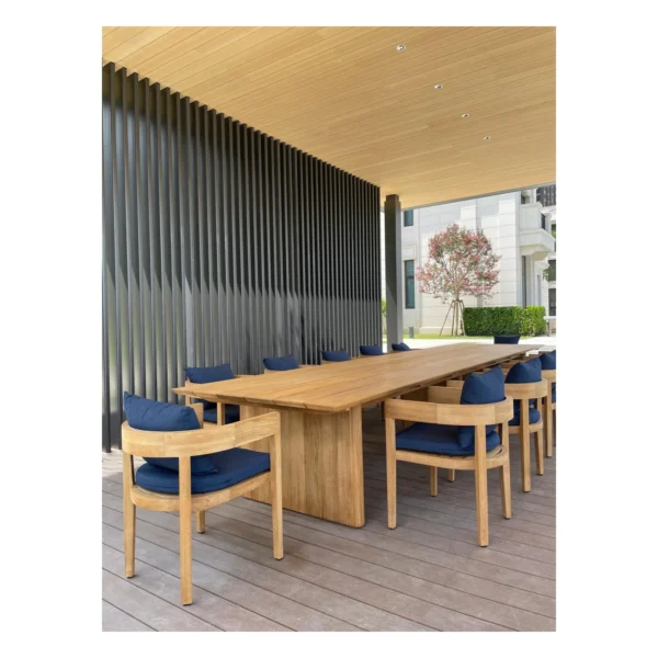 Burmese Teak Outdoor Long Table in natural oak — in a room setting
