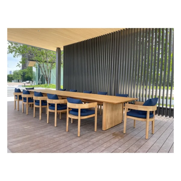 Burmese Teak Outdoor Long Table in natural oak — in a room setting