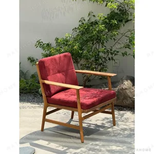 Burmese Teak Lounge Chair in Sappan Red Suede — in a room setting