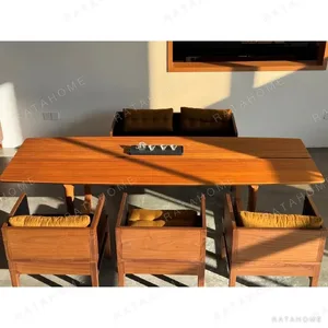 Tongzhou Burmese Teak Long Table with Chairs in natural oak — in a room setting