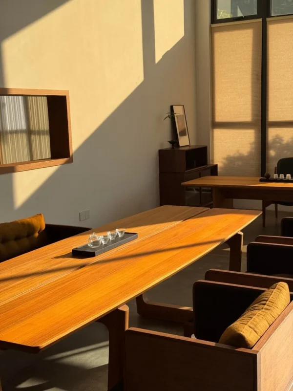 Tongzhou Burmese Teak Long Table with Chairs in natural oak — in a room setting
