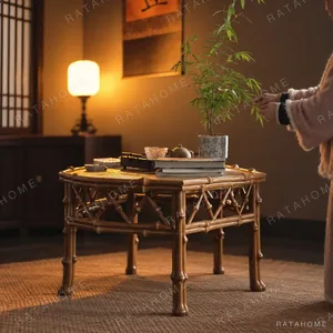 Cabriole Leg Bamboo Round Tea Table in clay — in a room setting