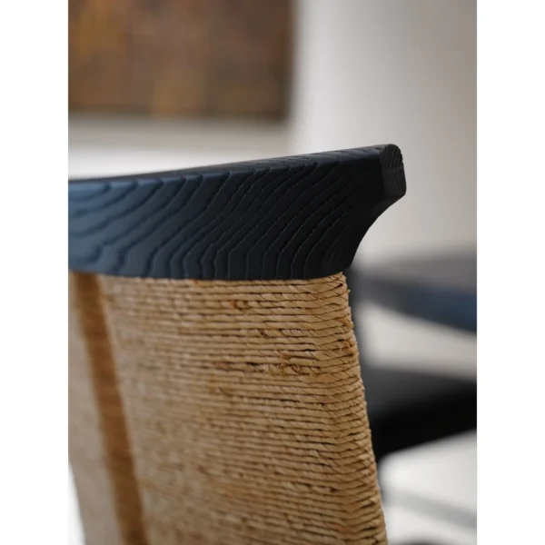 Cambon Black Oak Dining Chair with Woven Leather-Cord Back in black — in a room setting