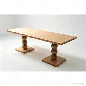 Beaded-Leg Ash Long Dining Table in natural oak — in a room setting