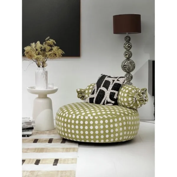 Candy Swivel Lounge Chair in olive — in a room setting
