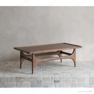 Capu Teak Coffee Table with Sculpted Legs and Framed Top in walnut — in a room setting