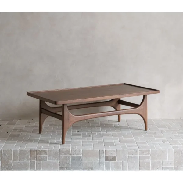 Capu Teak Coffee Table with Sculpted Legs and Framed Top in walnut — in a room setting