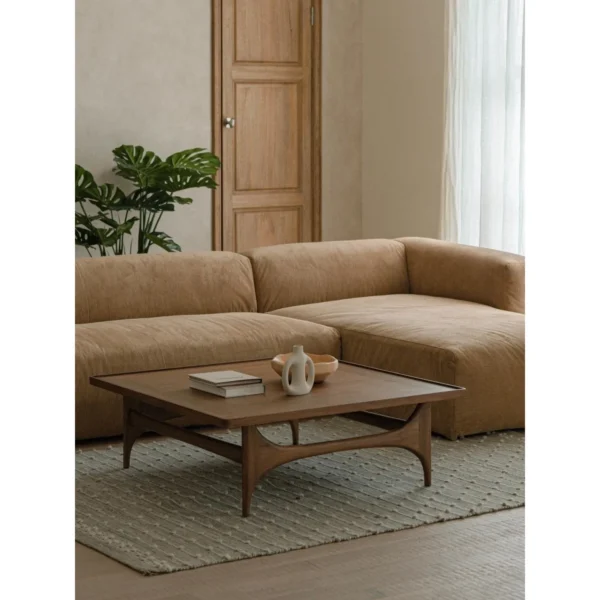 Capu Teak Square Coffee Table with Sculpted Legs in walnut — in a room setting