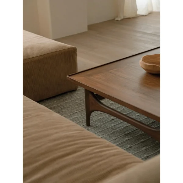 Capu Teak Square Coffee Table with Sculpted Legs in walnut — in a room setting