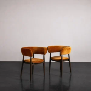 Caramel Velvet Curved-Back Dining Chair on Slim Dark Legs in rust — front view