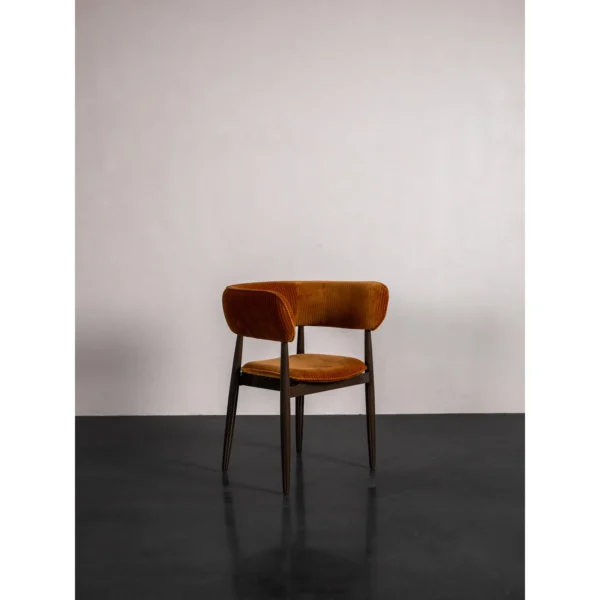 Caramel Velvet Curved-Back Dining Chair on Slim Dark Legs in rust — in a room setting