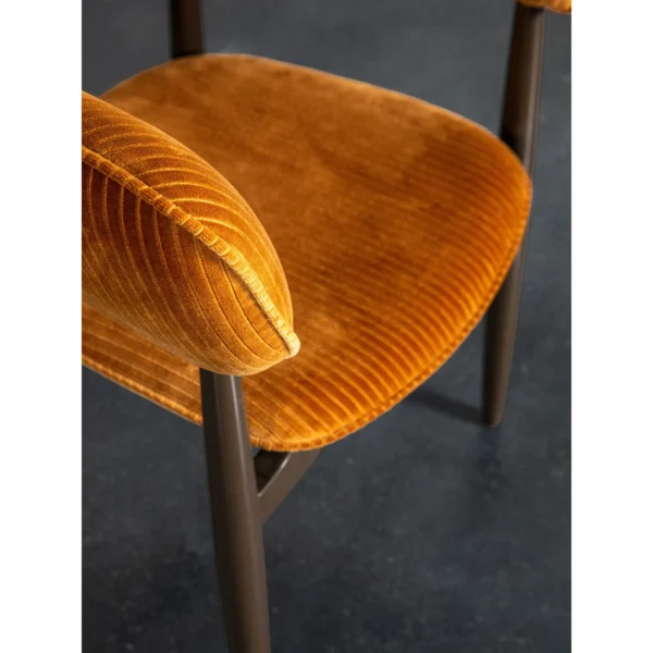 Caramel Velvet Curved-Back Dining Chair on Slim Dark Legs in rust — in a room setting
