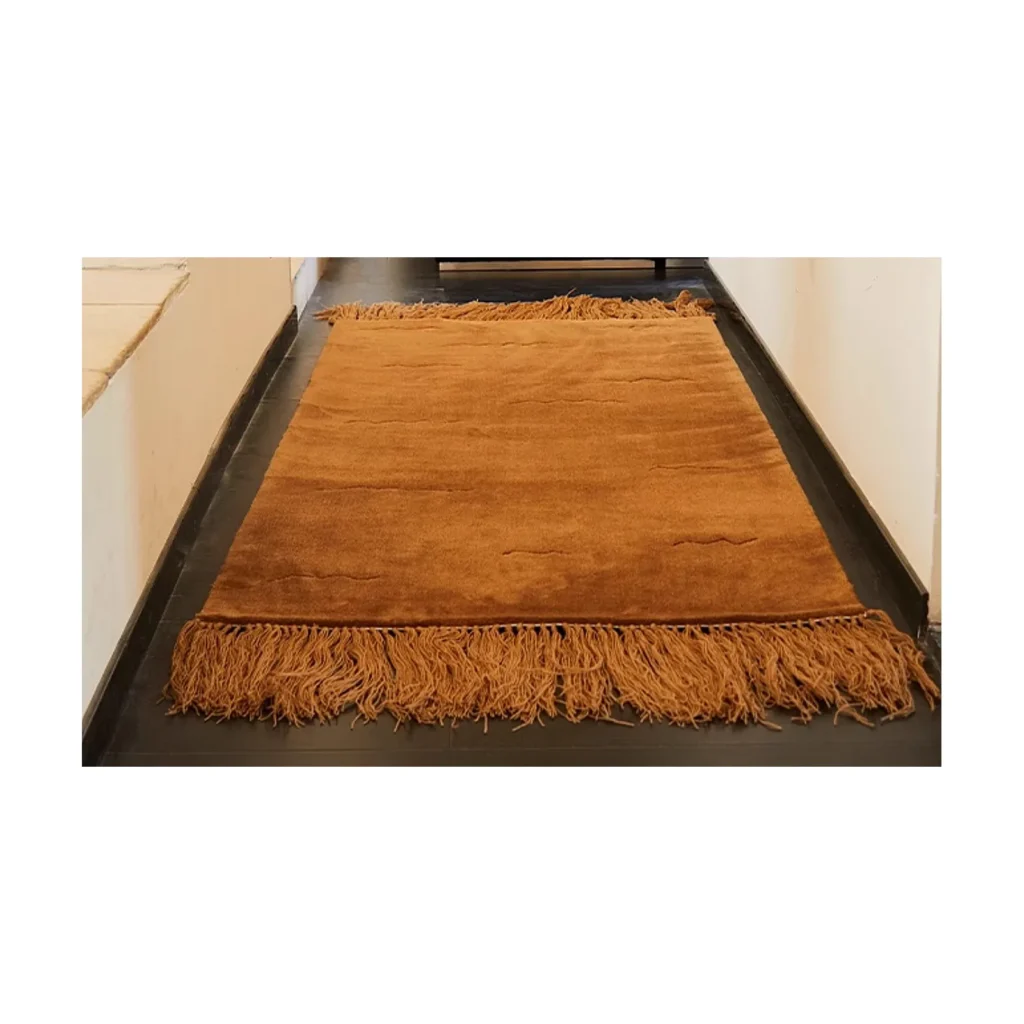 Caramel Fringed Rug in clay — front view