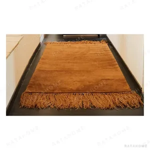 Caramel Fringed Rug in clay — in a room setting