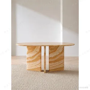 Caramel Onyx Round Dining Table on Curved Stone Legs in rust — in a room setting
