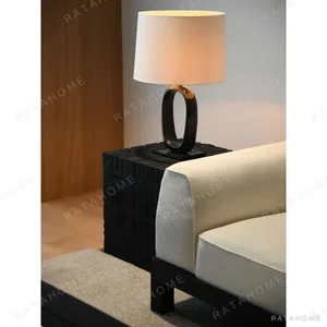Carved Black Oak Cube Side Table, 50 cm in black — in a room setting