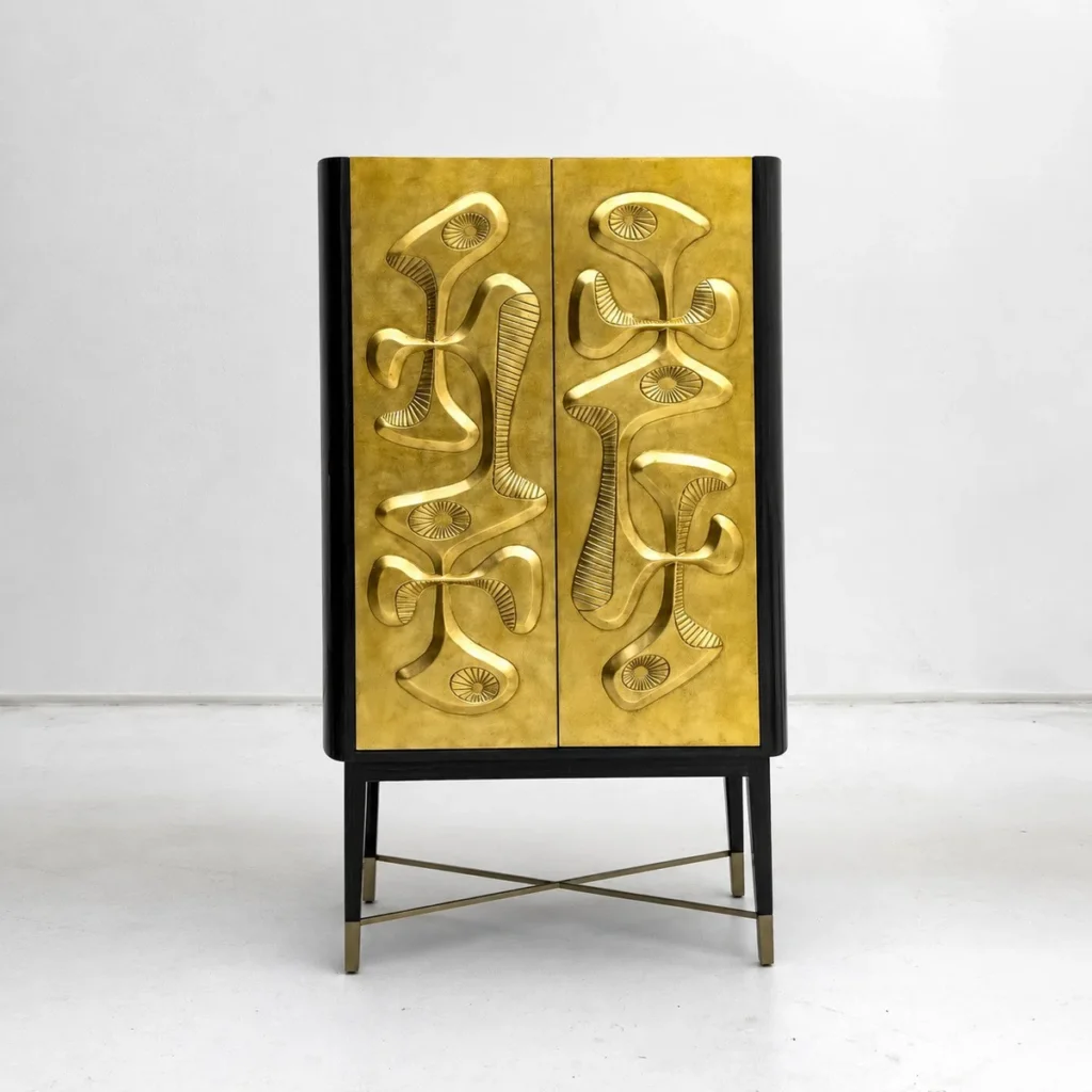 Gilded Relief Decorative Tall Cabinet on Brass Legs in brushed brass — front view