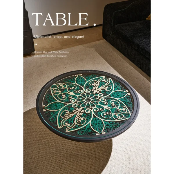 Carved Blue and White Floral Round Coffee Table in blue — in a room setting