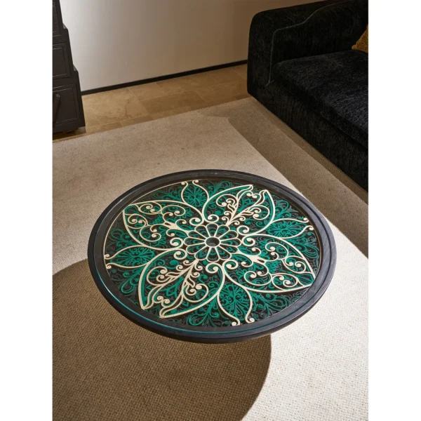 Carved Blue and White Floral Round Coffee Table in blue — in a room setting