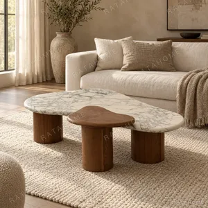 Cashew Marble Coffee Table in ivory — in a room setting