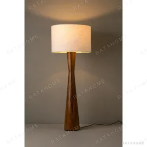 Ceiba Turned Wood Floor Lamp in clay — in a room setting