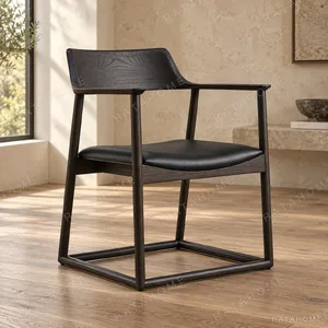 Yanlan Dark Wood Tea Chair with Black Leather Floating Seat in black — in a room setting
