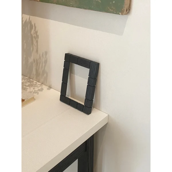Charbon Black Oak Nightstand with Lacquered Top in black — in a room setting