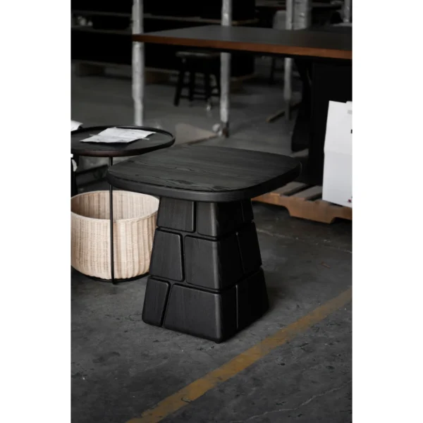 Charred Black Oak Low Table with Stacked Block Pedestal in black — in a room setting