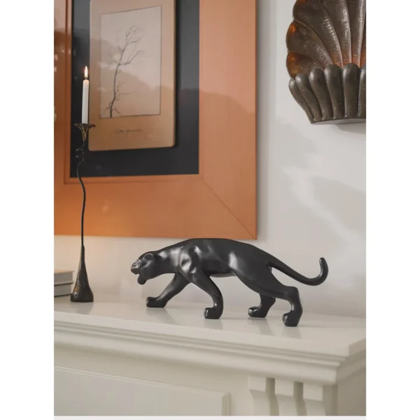 Prowling Cheetah Sculpture in Matte Black or Silver — in a room setting