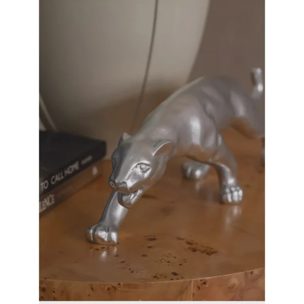 Prowling Cheetah Sculpture in Matte Black or Silver — in a room setting