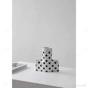 Black and White Polka Dot Sculptural Ceramic Vase, Large or in ivory — in a room setting