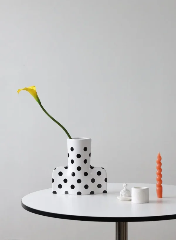 Black and White Polka Dot Sculptural Ceramic Vase, Large or in ivory — in a room setting