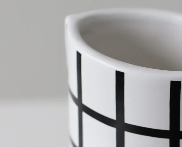 Black and White Polka Dot Sculptural Ceramic Vase, Large or in ivory — in a room setting