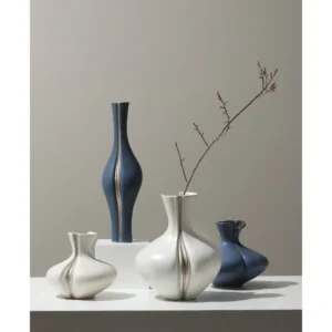 Sculptural Ceramic Bud Vases in Cream and Navy, Three Sizes — in a room setting