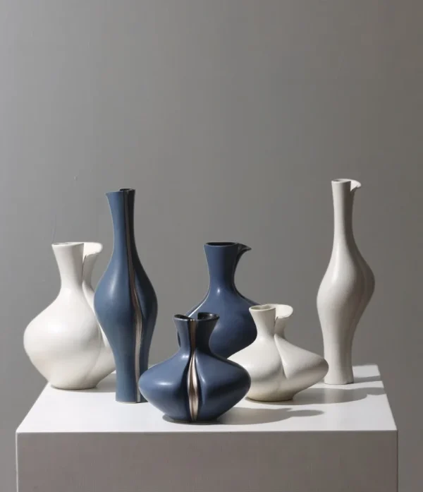 Sculptural Ceramic Bud Vases in Cream and Navy, Three Sizes — in a room setting