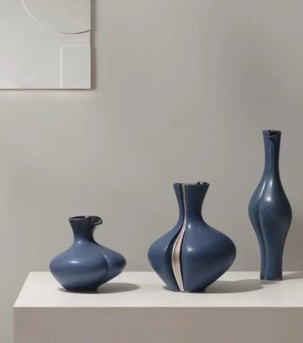 Sculptural Ceramic Bud Vases in Cream and Navy, Three Sizes — in a room setting