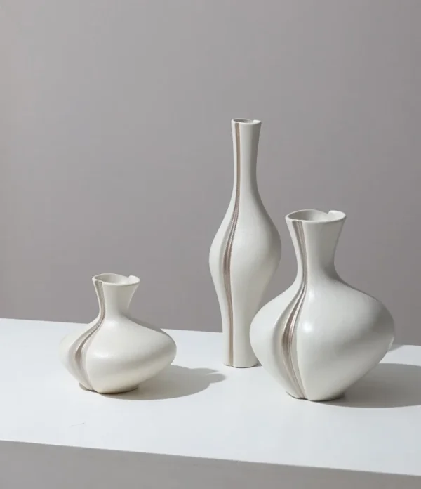 Sculptural Ceramic Bud Vases in Cream and Navy, Three Sizes — in a room setting