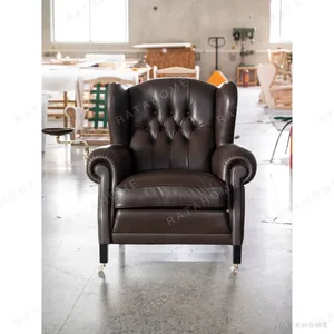 Cigar Wingback Armchair in clay — in a room setting