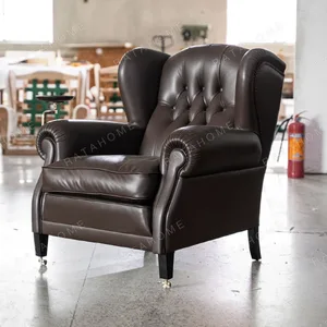 Cigar Wingback Armchair in clay — in a room setting