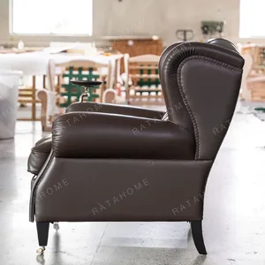 Cigar Wingback Armchair in clay — in a room setting
