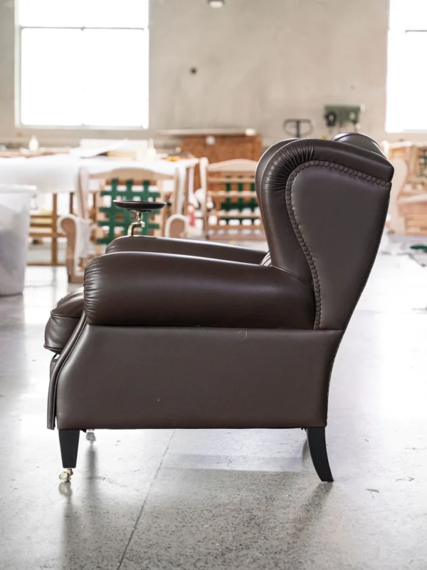 Cigar Wingback Armchair in clay — in a room setting